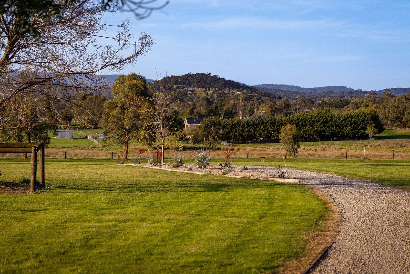 A path through the memorial garden with views to the hills