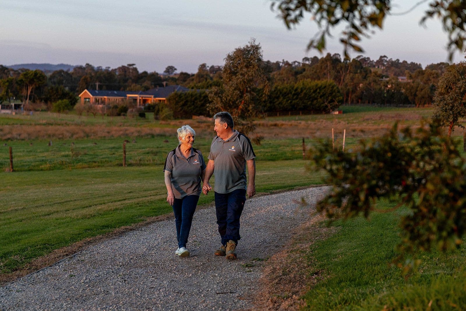 Terry and Karen Ryan walking through the cemetery grounds